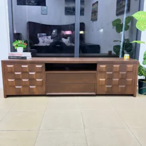 Monsoon Dover 6-foot brown TV stand with raised square geometric cabinet panels, central open shelf and smooth drawer-like fronts.