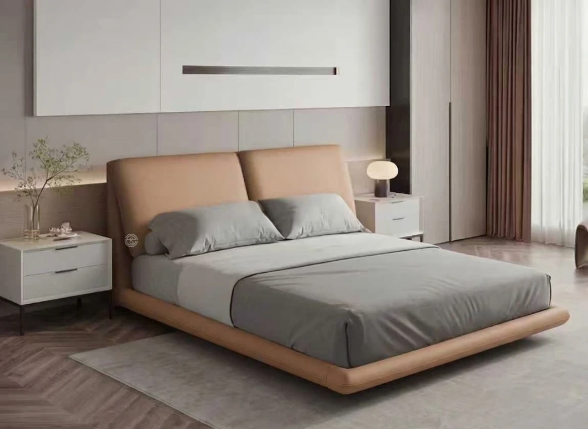 Monsoon Fernmont 5×6 tan upholstered bed with twin reclined padded headboard panels and matching rounded low-profile frame.