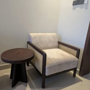 Hadley light upholstered armchair with woven sides and round stool