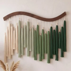Green and cream ombre tassel wall art with brown wave top